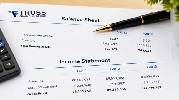 Self-employed borrower organizing proof of income documents for a mortgage application