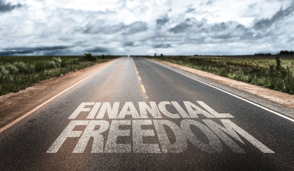 Financial Freedom written on rural road-1