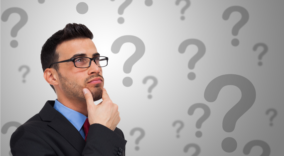 picture of a man thinking about a question with question marks in background