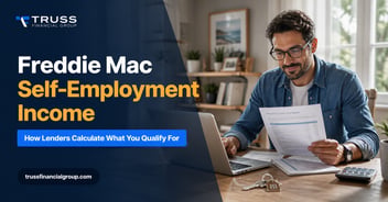 Self-employed business owner reviewing income documents for a Freddie Mac mortgage