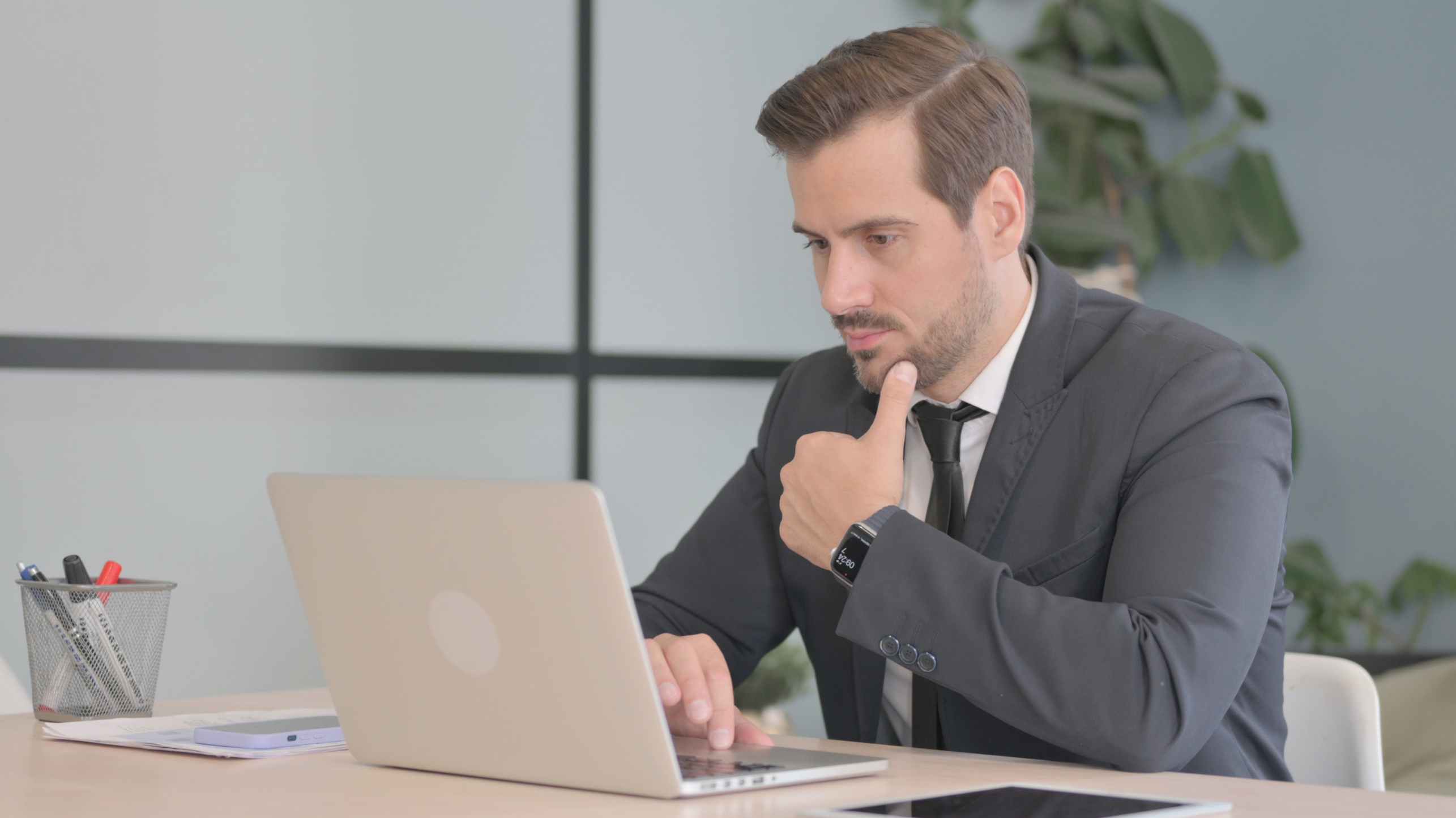 picture of a man surfing on lapton while thinking about no-income loan