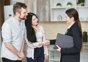 Couple talking about lending and debt to income ratio requirements