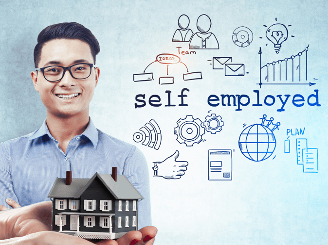 self employed smiling man with home miniature in the picture