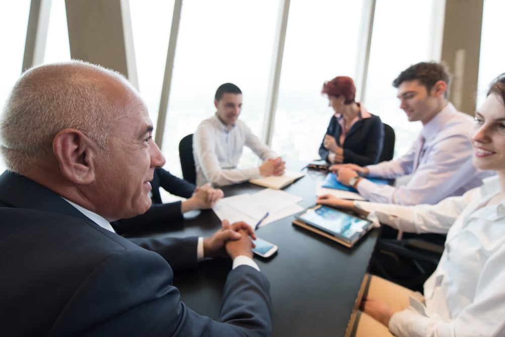startup business people group have meeting in modern bright office interior, senoir investors and young software developers